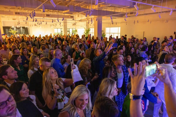 The crowd dances and sings along to the live performed by Nile Rodgers & Chic in the Bernhardt showroom
