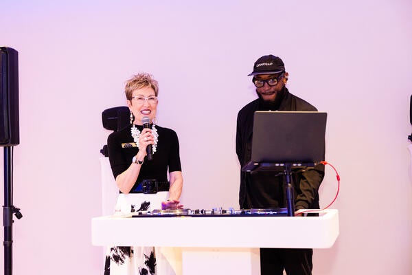 Bernhardt director of brand development Heather Eidenmiller  beside DJ RaQuest