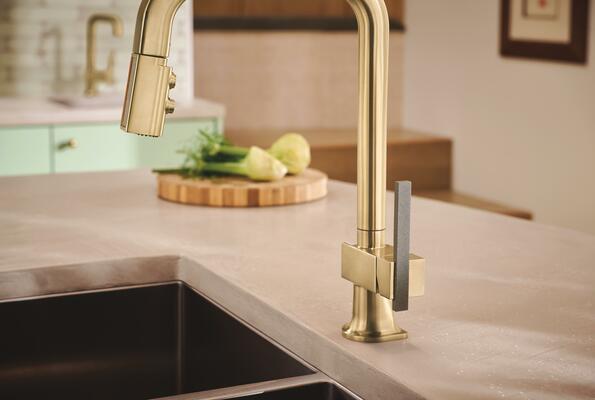 Pull-down kitchen faucet with offset concrete lever handle in Brilliance Luxe Gold