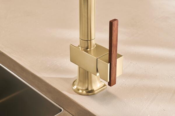 Pull-down kitchen faucet with offset wood lever handle in Brilliance Luxe Gold