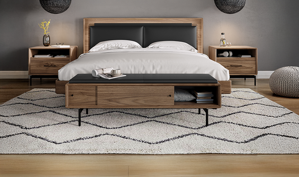 Linq bedroom in Walnut with black leather upholstered storage bench and headboard