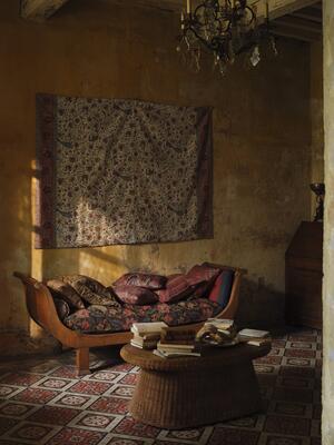 Reimagining a 19th century Kalamkari block print, Mughal Menagerie frames peacocks, elephants and other creatures within an intricate, decorative border