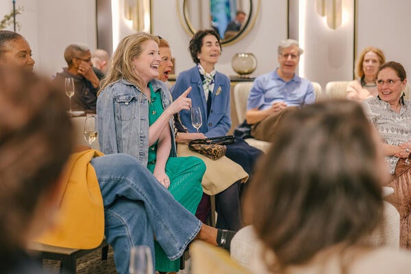 Guests, including Nancy and Catherine Scully (center), react to the conversation