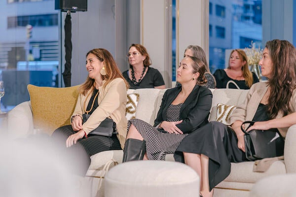 Guests, including Tina Outeiro of Ethan Allen, listen to the discussion