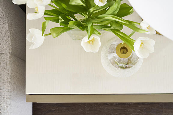Splendor’s selenite nightstand features a Sea Salt finish on top and three storage drawers