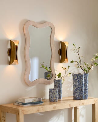 Capsule wall sconce, Dali mirror, Archer console, Cloud vases
