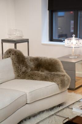 The Cubist Curve sofa with throw from Rottet Collection