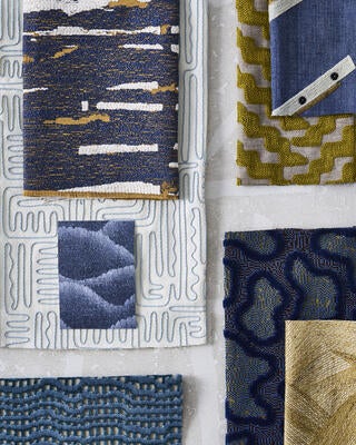 Various Defined Momentum fabrics in hues of gold and blue