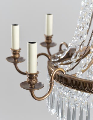 Conholt chandelier: The frame is given an antiqued brass finish with a clear lacquer 