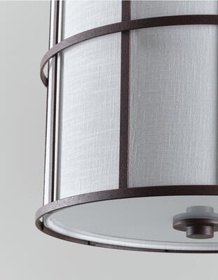 Ashmore Shade lantern: A natural-colored linen shade illuminated by a diffuser made from frosted glass