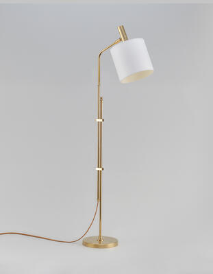 Tangley floor lamp: A solid cast-brass base and head with brass stems and joint components 