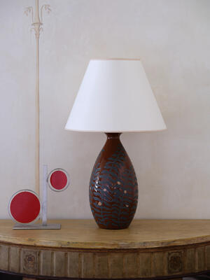 A delicate botanical motif graces the Fern lamp, now available in a rich brown glaze