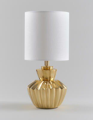 Edington table lamp: Cast in brass, the lamp is modernist in style