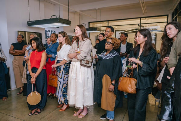 Guests listened to remarks by the hosts