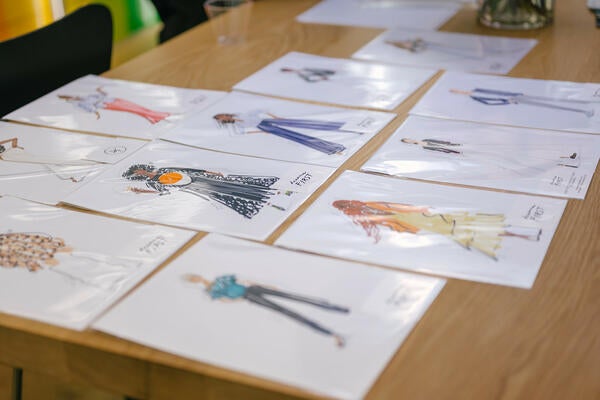 With pen and marker, portrait artist Deanna First captured the likenesses of designer guests