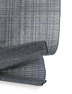 Handwoven from reclaimed denim and ramie, Genoa explores color through texture and tone 