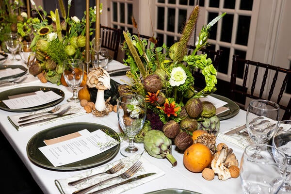 The tablescape, designed by the Boll & Branch team, featured rich hues and fresh produce
