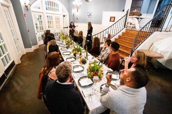 Guests listen as Lainey Hollis and Kaitlin Petersen welcome their special guests