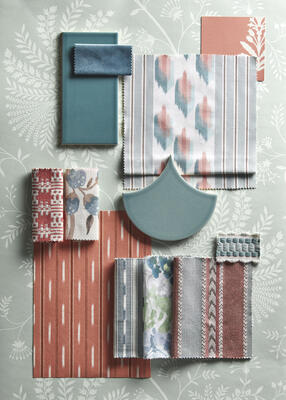 Curios fabrics and wallcoverings in hues of blue and russet