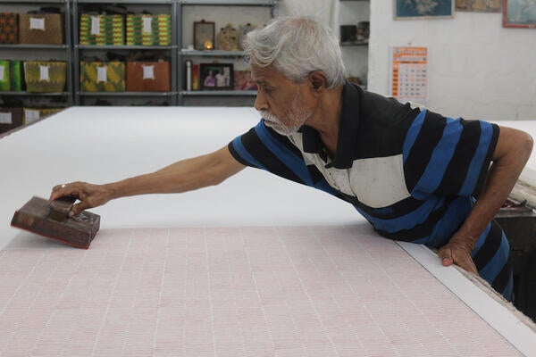 Tanjore hand-block-printed fabric in Rani Pink