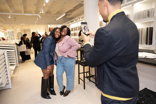 Asa Davis of Design Build by Asa snaps a picture of Whitney Davis and Rashida Banks