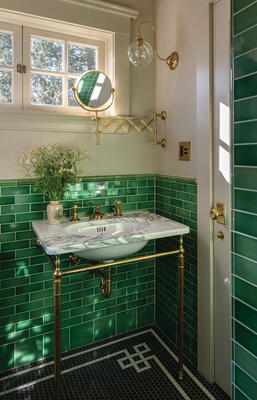 Custom Mosaic border design paired with Hunter Green Subway Tile.