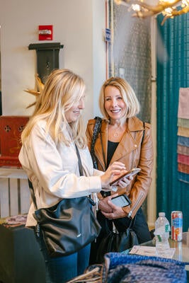 Guests shopping at John Rosselli & Associates