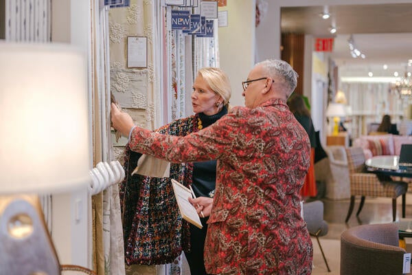 Scott?TK shares new fabrics with a client in the John Rosselli & Associates New York showroom