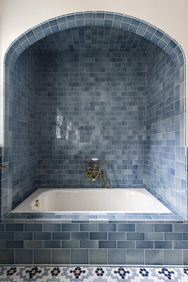 This Sky Blue translucent crackle subway tile tub surround creates a dramatic yet pure experience