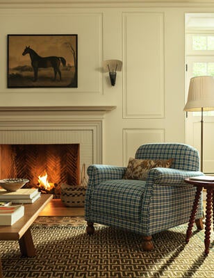 The Paley chair features a rounded back and rolled arms for a touch of traditional charm