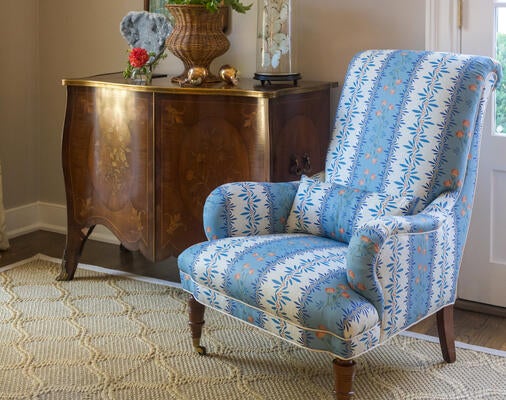 Chandler linen fabric in Terracotta Blue Haze stunningly upholsters a wingback chair