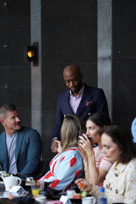Designer Mikel Welch mingling at a private breakfast hosted by Modern Luxury and FreePower