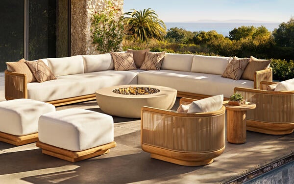 Brera collection in premium solid teak and all-weather rope shown with the Obround fire table