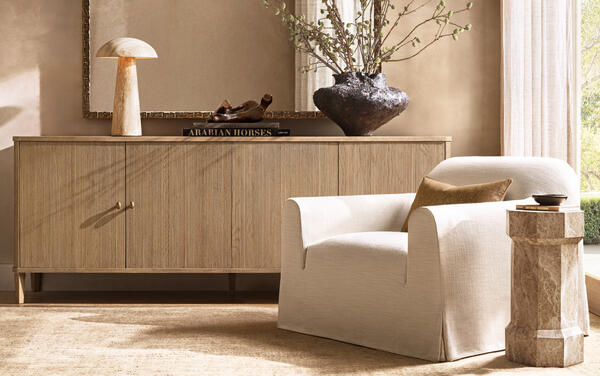 Delphine reeded sideboard in American white oak shown with the Monastère waterfall lounge chair