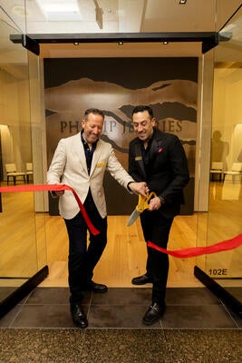 Philip and Jeffrey Bershad cutting the ribbon
