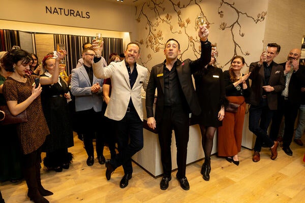 Brothers Philip and Jeffrey Bershad raise a toast