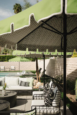 Michael Norpell’s patio outfitted with Thibaut indoor/outdoor fabrics and Thibaut x Santa Barbara umbrellas