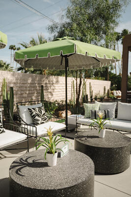 Michael Norpell’s patio outfitted with Thibaut indoor/outdoor fabrics and Thibaut x Santa Barbara umbrellas