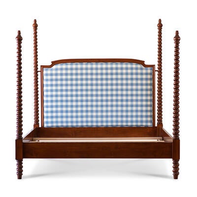 The Betsy Barley Twist upholstered four-poster bed is a classic beauty with hand-turned spindles