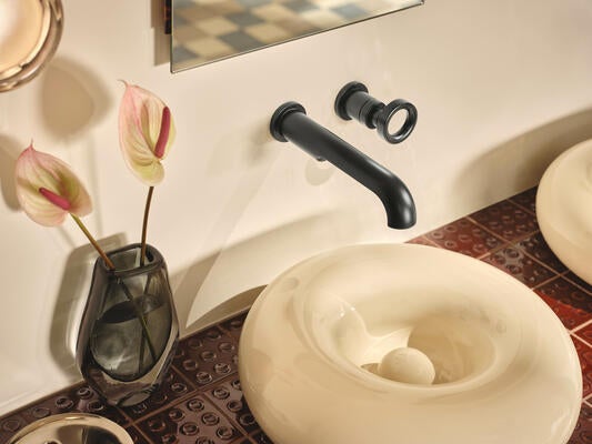 Circular motifs echo the geometric influences of Italian modernism