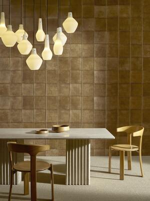 Reliure from Arte’s Allures wallcovering collection features stitched suede squares