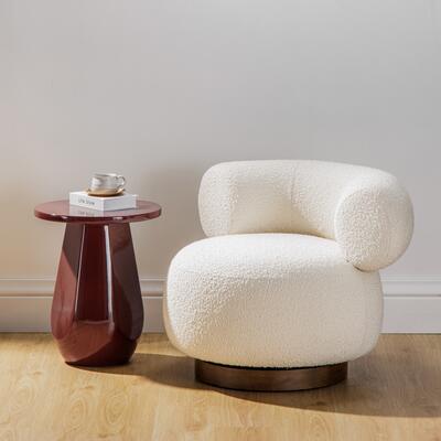 Lloyd side table in Crimson paired with Aubrey swivel chair in Ivory boucle fabric