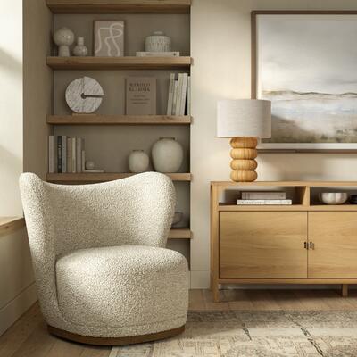Odell swivel chair in Ivory sherpa fabric with Cali oak sideboard and Sandia lamp in rattan