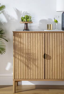 Olive entryway cabinet styled for any space, showcasing reeded design details