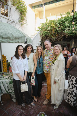 (From left) Emily Finch and Jihan Spearman, with Terry Mclaughlin (second from right) and guests