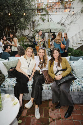 Guests enjoying the CW Stockwell x Sunbrella Cabana in the courtyard of the Chief Clubhouse