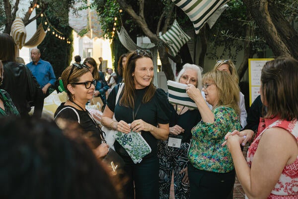 Guests checking out the CW Stockwell x Sunbrella travel pouches