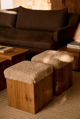 Antwerp ottomans top a French oak base with New Zealand shearling