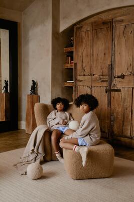 Papa Teddy chair and ottoman in Camel boucle woven in Waregem, Belgium 