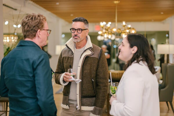 Nathan Orsman (center) with guests